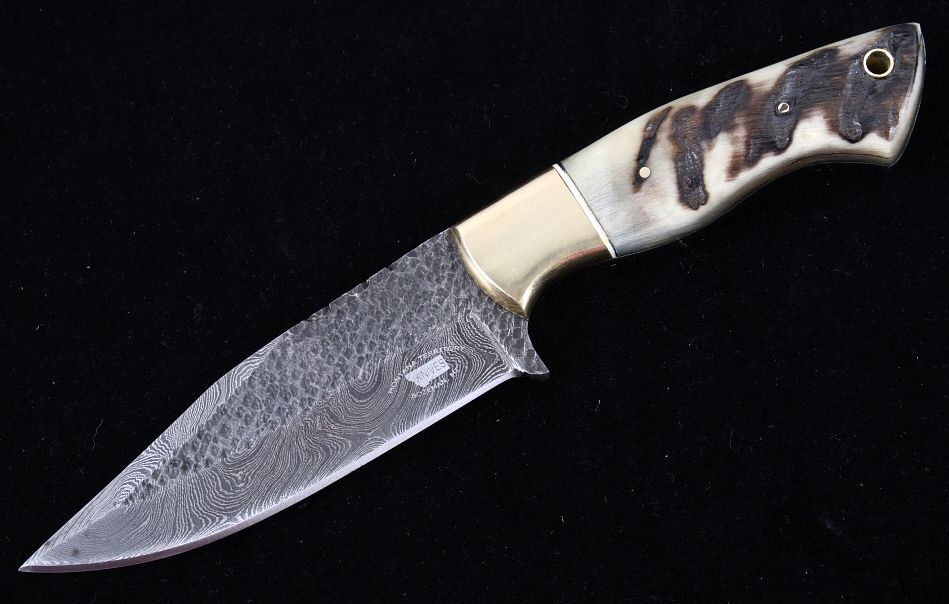 Appraisal: M T Knives Rams Horn Damascus Hammered Knife This is