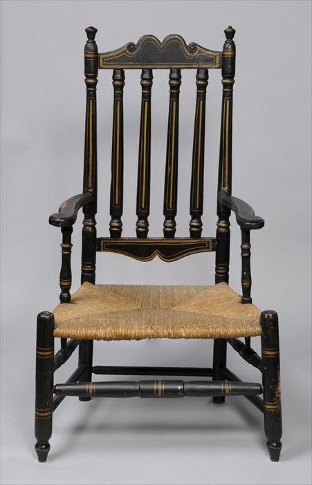 Appraisal: NEW ENGLAND WILLIAM AND MARY BLACK-PAINTED BANISTER-BACK ARMCHAIR The shaped