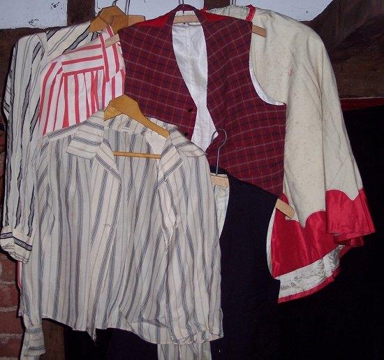 Appraisal: A cape two tartan waistcoats and three ladies silk blouses