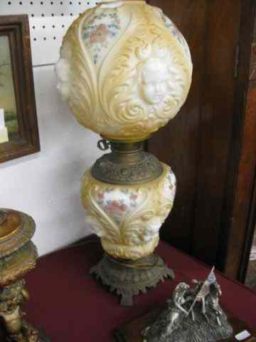 Appraisal: Victorian Parlor Lamp with Cherub decor blownout glass base globe