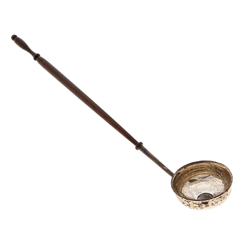 Appraisal: A silver punch ladle the bowl inset with a Charles