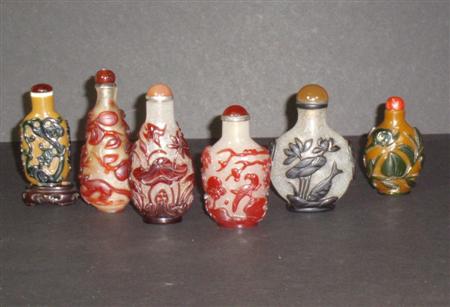 Appraisal: A collection of Chinese overlay glass snuff bottles comprising a