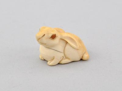 Appraisal: Seated Rabbit Netsuke The White Rabbit carved ivory with inset