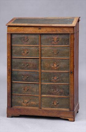 Appraisal: EMPIRE PROVINCIAL WALNUT BUREAU EN PENT AND CARTONNIER The leather-lined