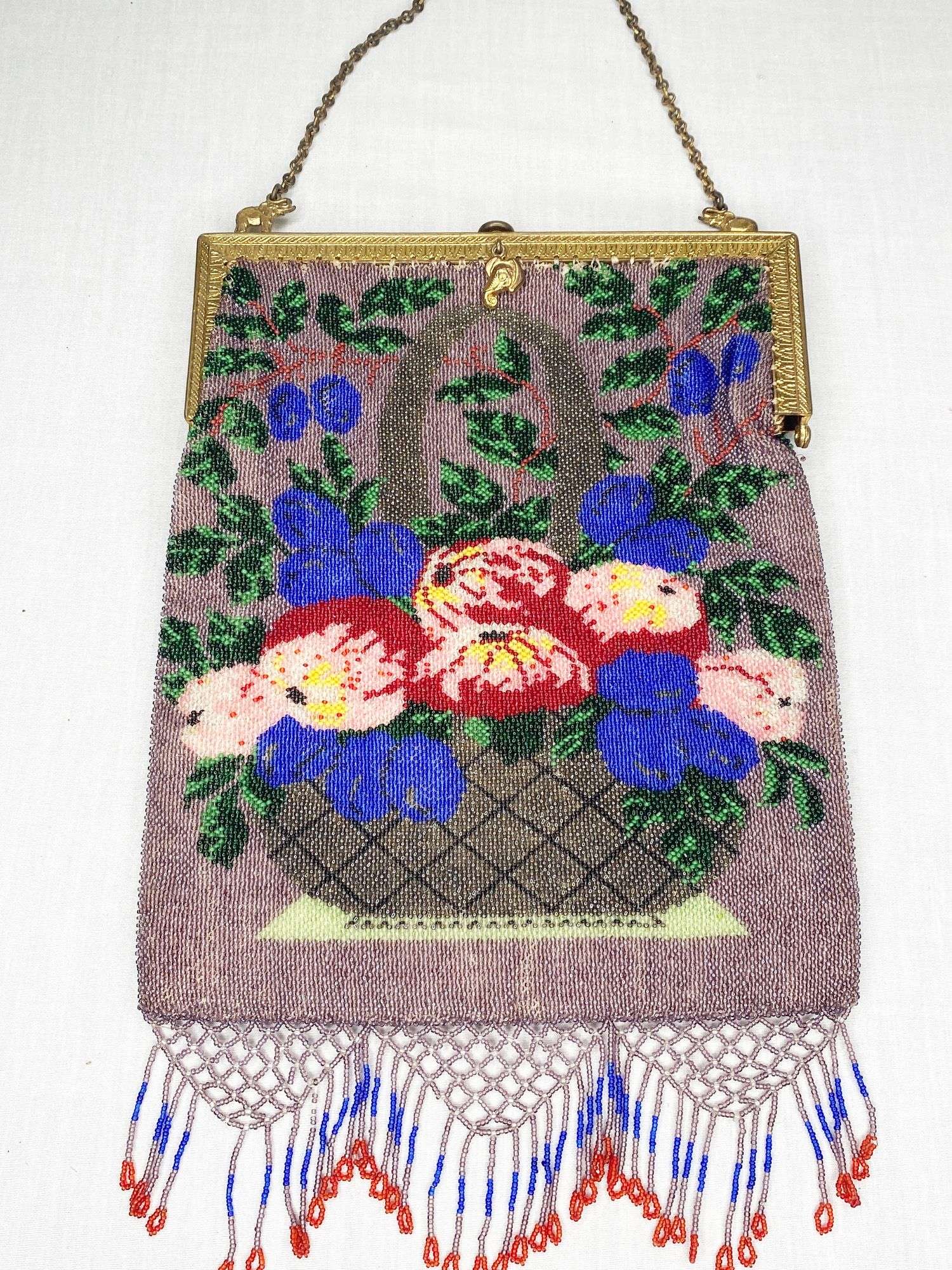 Appraisal: Micro Beaded Hand Bag with Roses and Elephant frame long