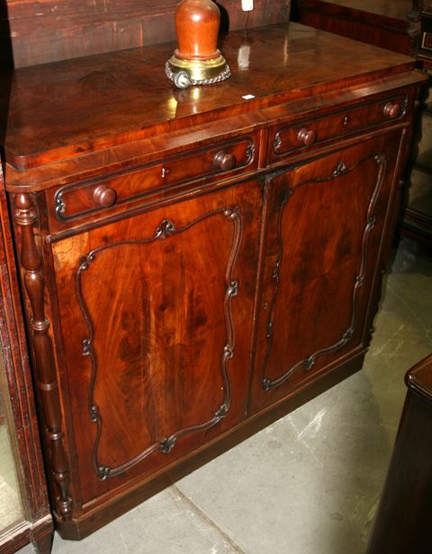 Appraisal: A mid th century Austrian mahogany two door cupboard