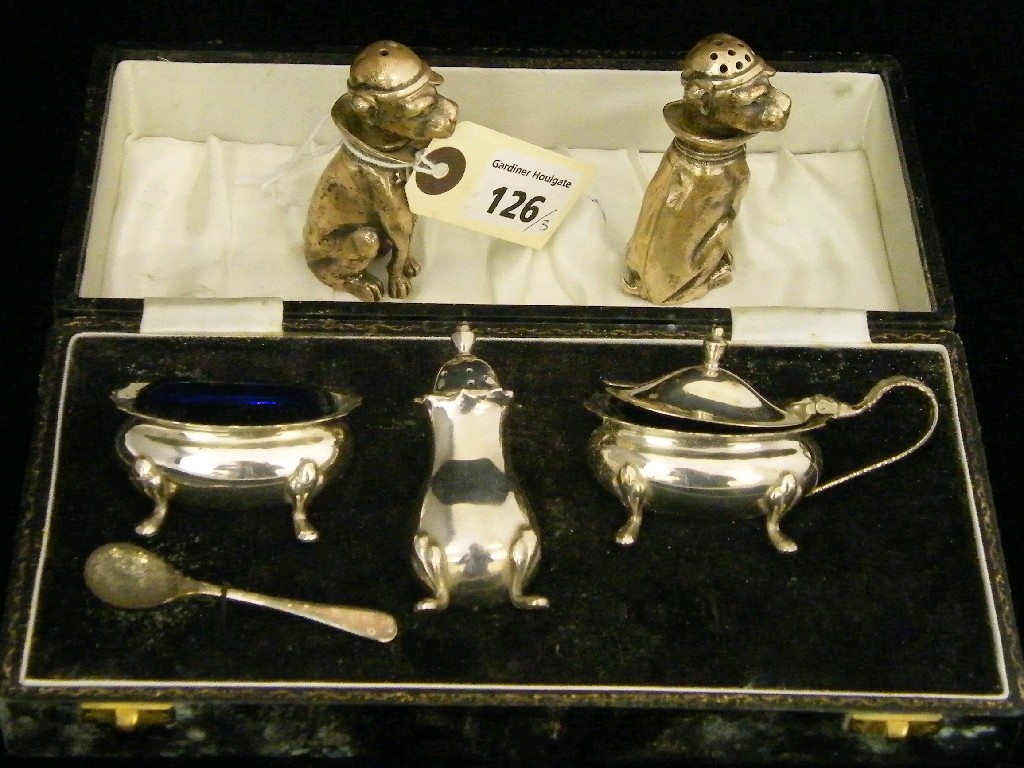 Appraisal: Pair of white metal novelty salt and pepper shakers modelled