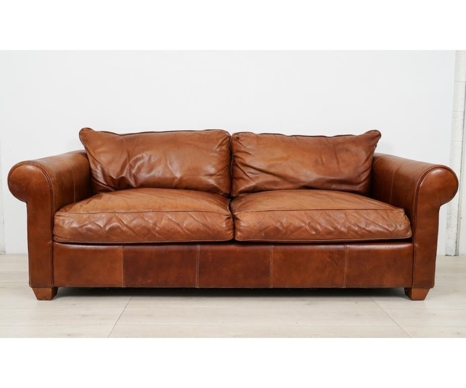 Appraisal: Brown leather stitched sofa with back pillow rests attached h