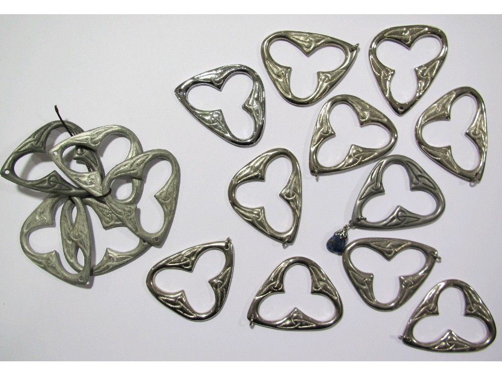 Appraisal: Fifty Dove and Cross lead die case pendants polished pewter