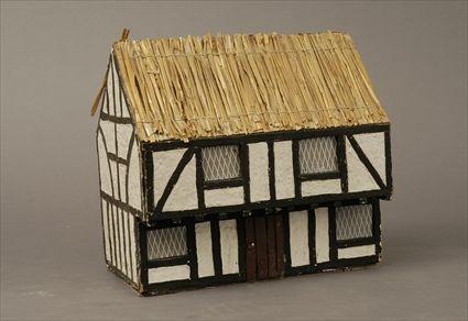 Appraisal: English Paperboard Model of a Half-Timbered House with Thatched Roof