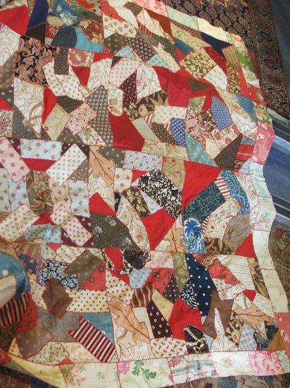 Appraisal: A VICTORIAN STYLE PATCHWORK QUILT with multi-coloured fragment decoration x