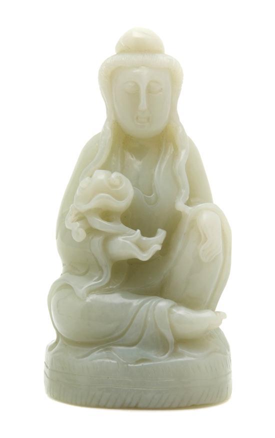 Appraisal: Carved Jade Figure of Guanyin raised on a lotus form