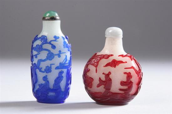 Appraisal: TWO CHINESE OVERLAY GLASS SNUFF BOTTLES Each of flattened ovoid-form