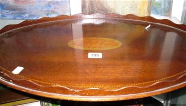 Appraisal: A serpentine shaped galleried serving tray and an oak tray