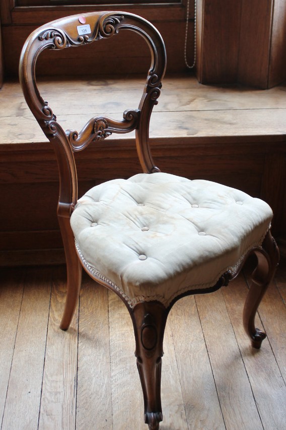 Appraisal: A Victorian walnut bedroom chair with scroll carved cameo back