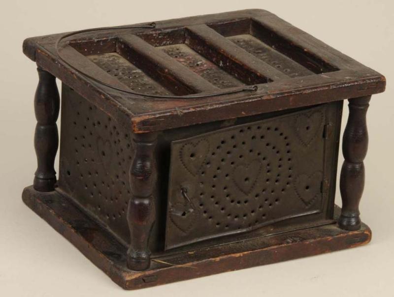 Appraisal: Wood Tin Foot Warmer Description th Century With punched heart