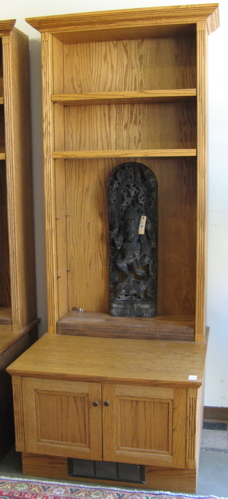 Appraisal: TALL OAK BOOKCASE ON STAND American th century The bookcase