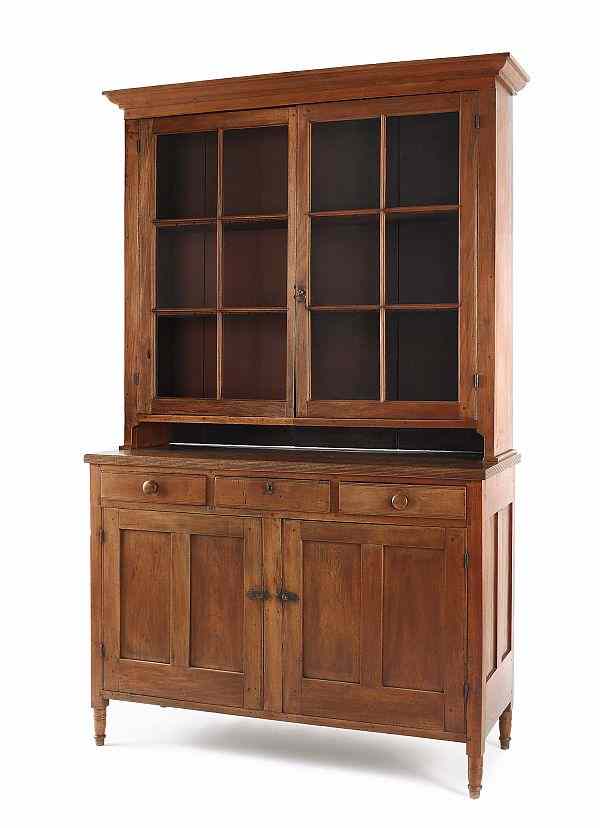 Appraisal: Pennsylvania Sheraton walnut Dutch cupboard ca in two parts the