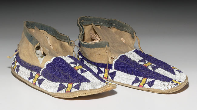 Appraisal: Sioux moccasins ca hide with a colorful beaded geometric design