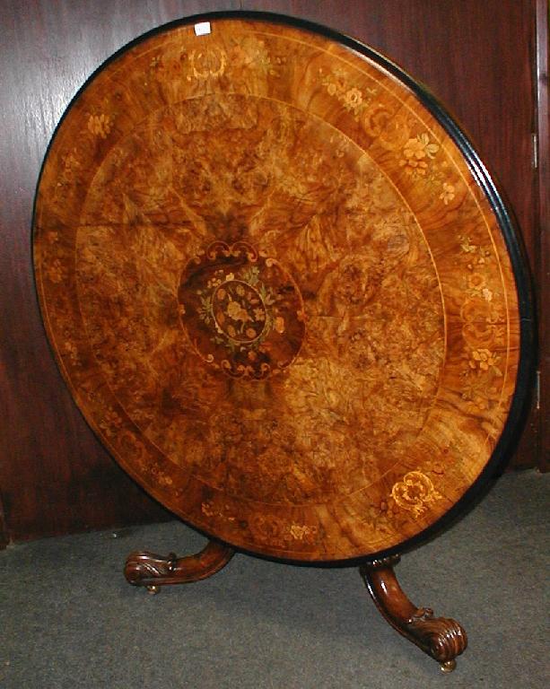 Appraisal: A fine Victorian figured walnut loo table with moulded ebonised