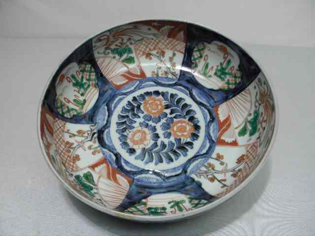 Appraisal: Imari pattern round hand painted bowl Floral landscape design Condition