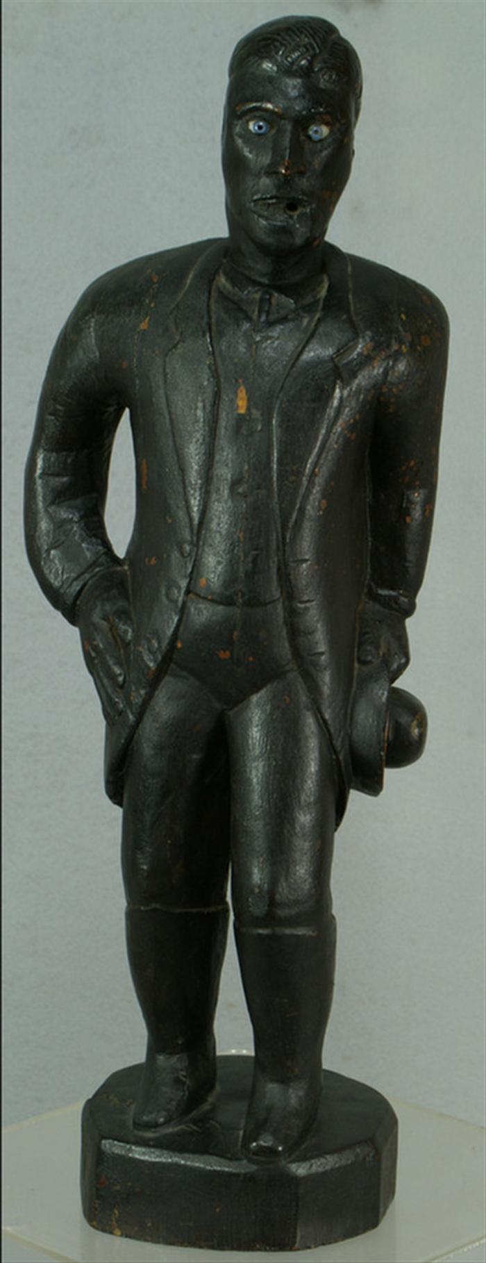 Appraisal: Carved black painted wood folk art figure of a man