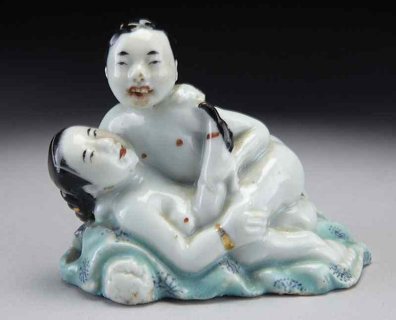 Appraisal: Chinese erotic famille rose porcelain figure groupwith the book ''A