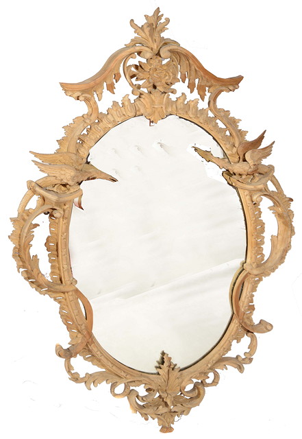 Appraisal: AN ANTIQUE CARVED PINE HANGING WALL MIRROR IN THE MANNER