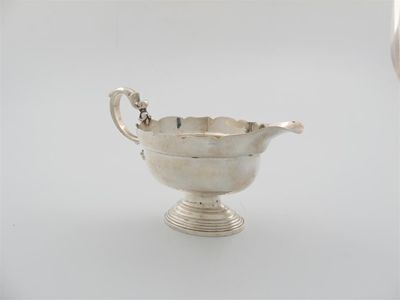 Appraisal: A silver sauce boat by D Collins London oval form