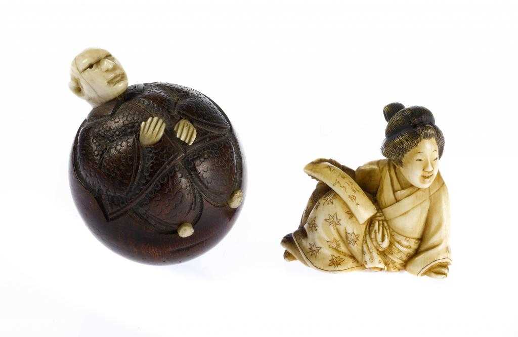 Appraisal: A JAPANESE WOOD AND IVORY OKIMONO of a comical man