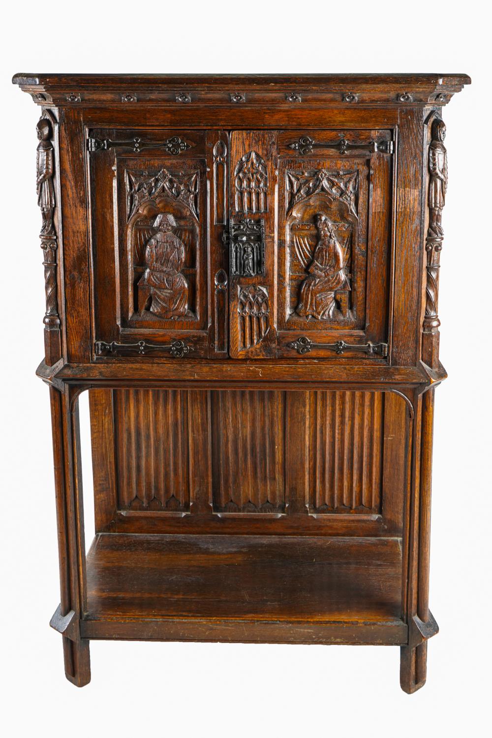 Appraisal: GOTHIC STYLE CARVED OAK CABINETearly th century with iron mounts