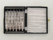 Appraisal: A set of six stainless steel forks with silver Queens