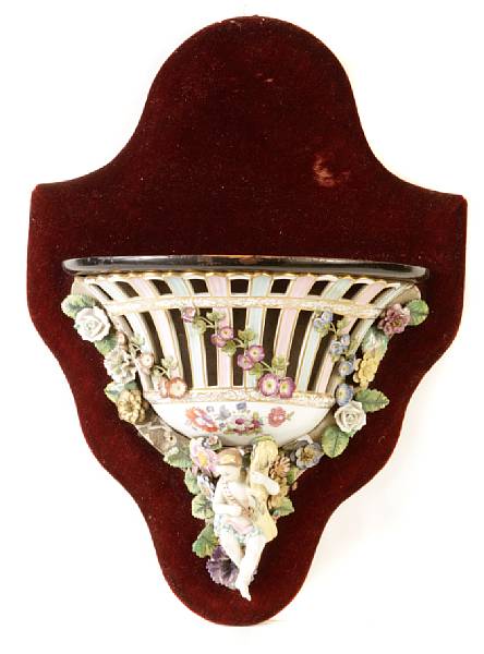 Appraisal: A pair of German porcelain figural and floral encrusted wall