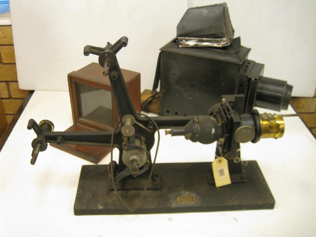 Appraisal: A Butcher Sirus hand crank mm Film Projector a Magic