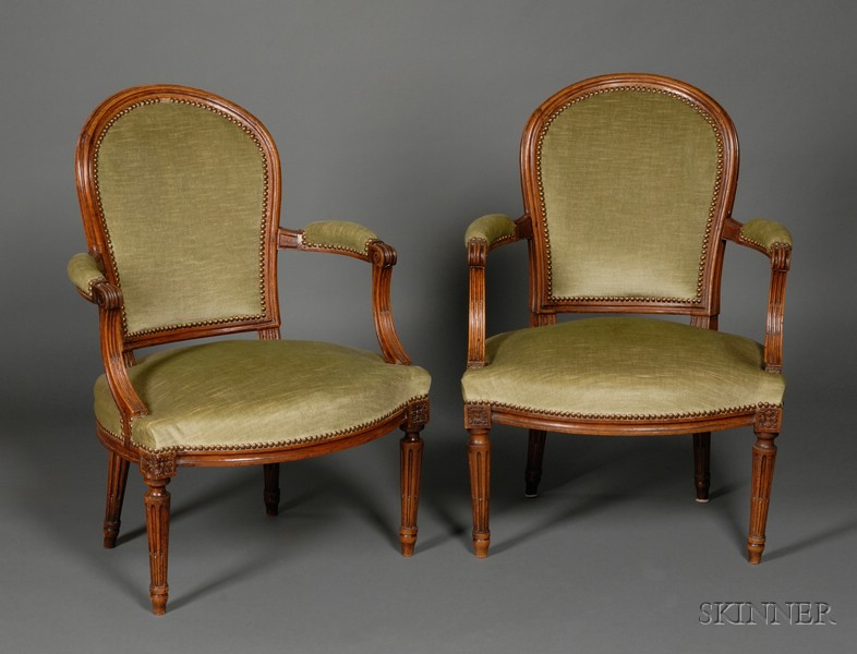 Appraisal: Pair of Louis XVI Walnut Fauteuils en Cabriolet th century