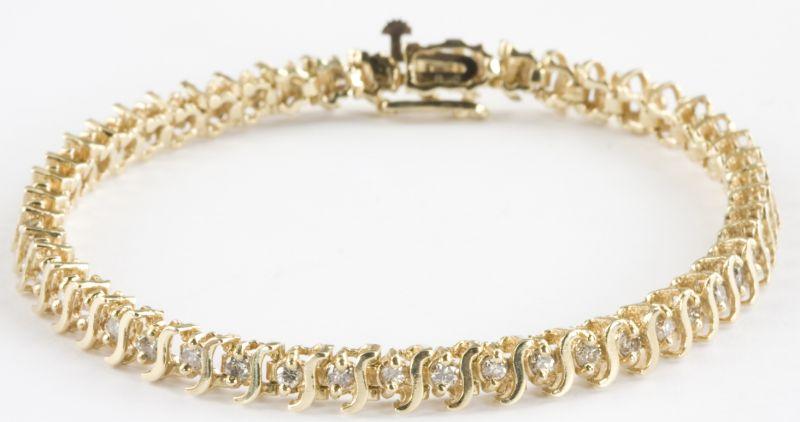 Appraisal: KT Yellow Gold and Diamond S-Bar Tennis Bracelet with alternating