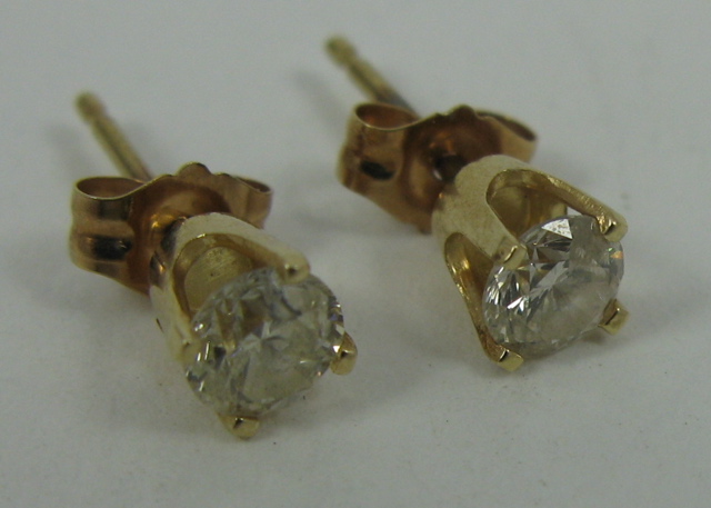 Appraisal: PAIR OF DIAMOND AND FOURTEEN KARAT GOLD EAR STUDS each