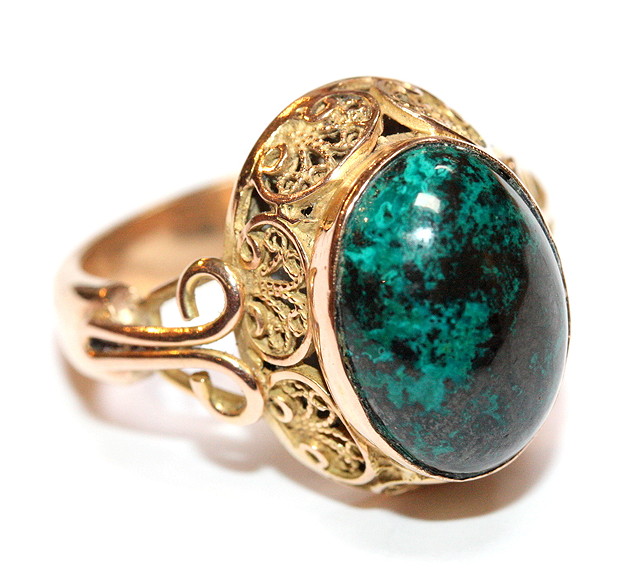 Appraisal: A MALACHITE SET DRESS RING oval cabochon cut stone mounted