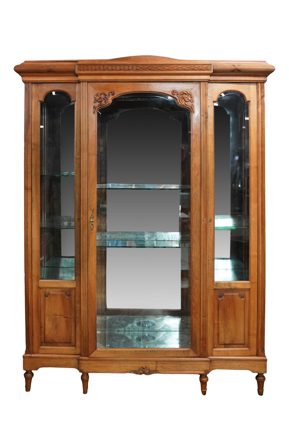 Appraisal: NEOCLASSIC STYLE VITRINEwalnut or fruitwood having three doors inset with