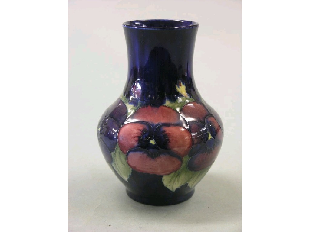 Appraisal: A Moorcroft vase 'Pansy' baluster shape painted against a deep