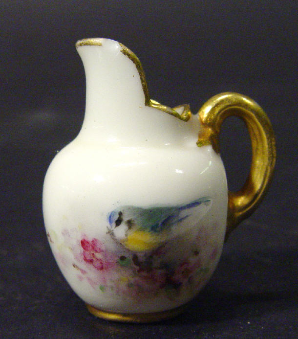 Appraisal: Miniature Royal Worcester porcelain jug painted with a blue tit