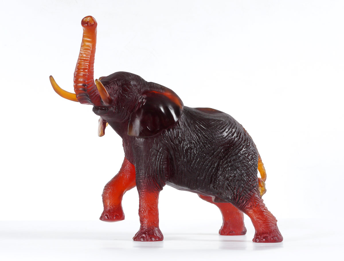 Appraisal: DAUM PATE DE VERRE ELEPHANT With a red amber tone