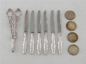 Appraisal: A set of German silver-handled cheese knives stamped with stainless