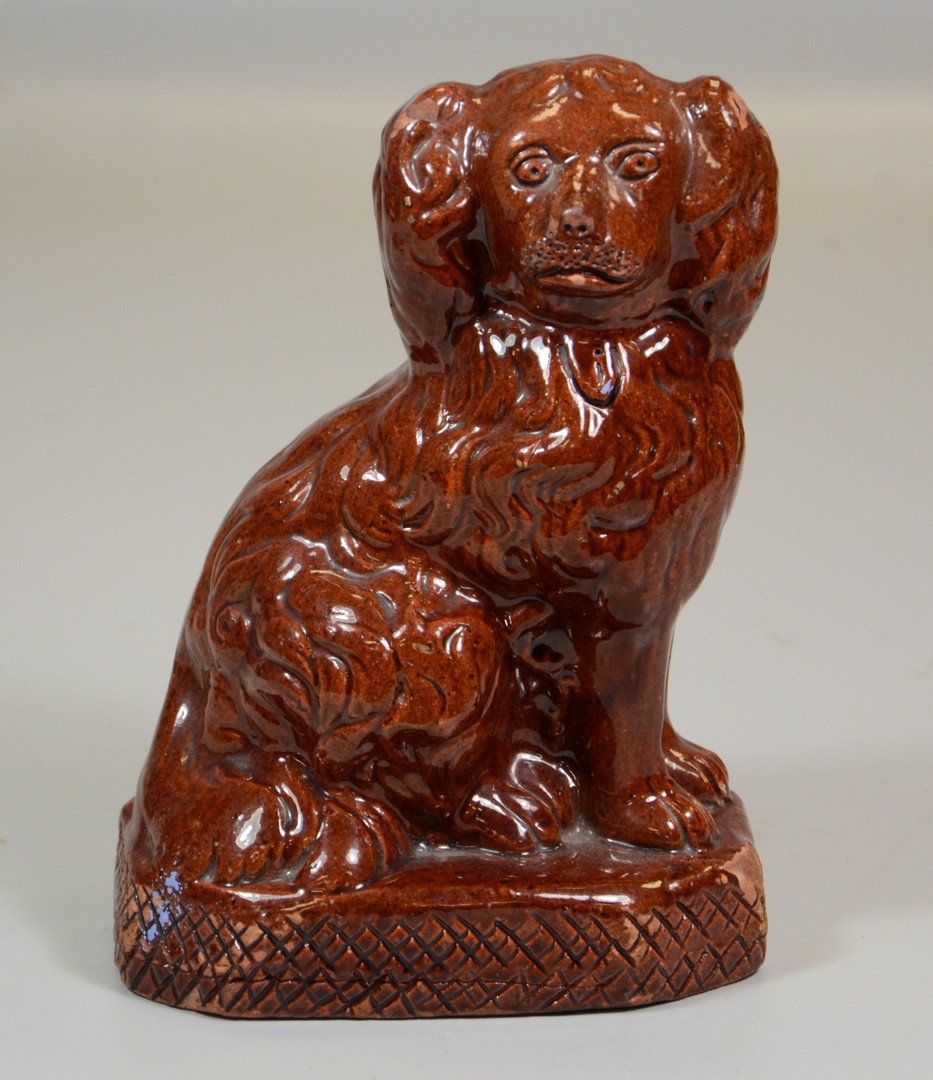 Appraisal: PA redware seated spaniel glazed finish on a platform base