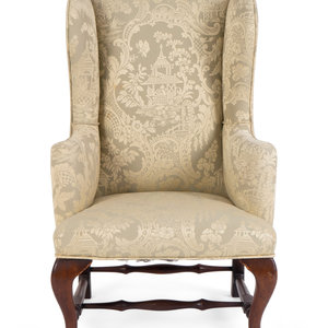 Appraisal: A Chippendale Style Diminutive Mahogany Wing Chair TH CENTURY upholstered