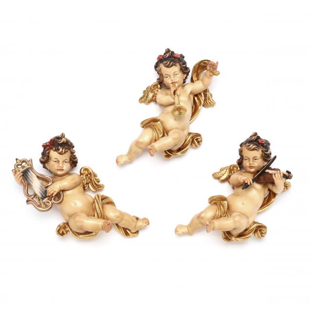 Appraisal: PEMA THREE ITALIAN WOOD CARVED REICHBERGER ANGEL ORNAMENTS Late th