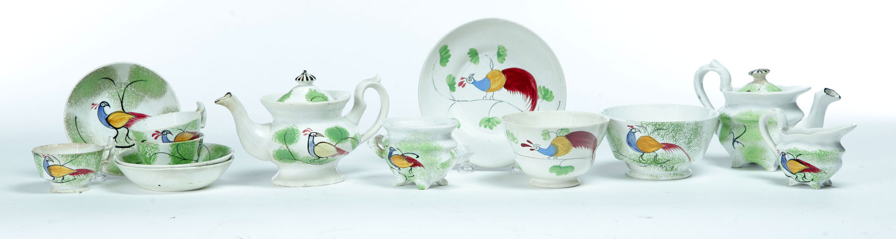 Appraisal: CHILD'S SPATTERWARE TEA SET England nd quarter- th century Peafowl