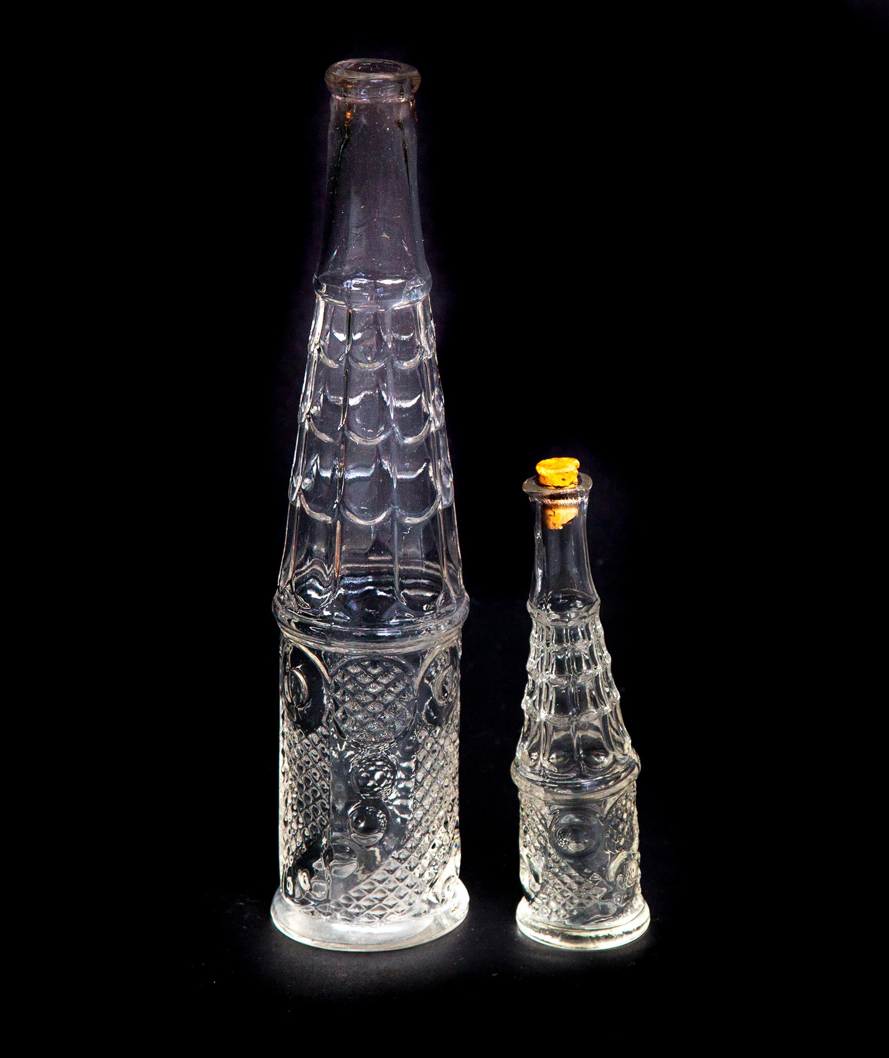 Appraisal: TWO HORN OF PLENTY PATTERN FLINT GLASS PEPPER SAUCE BOTTLES