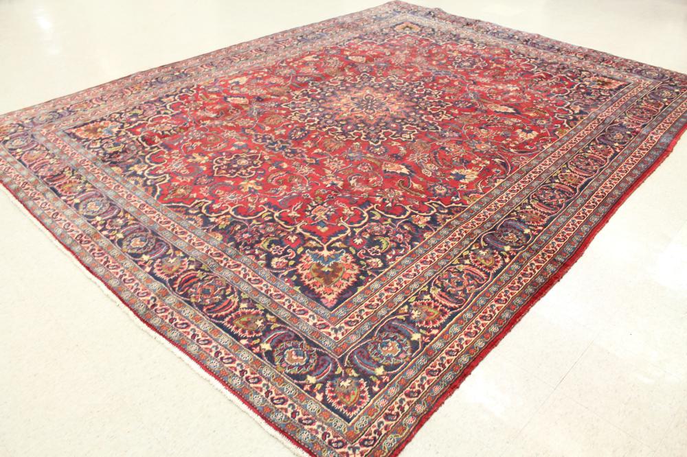 Appraisal: HAND KNOTTED PERSIAN CARPET floral and central floral medallion design