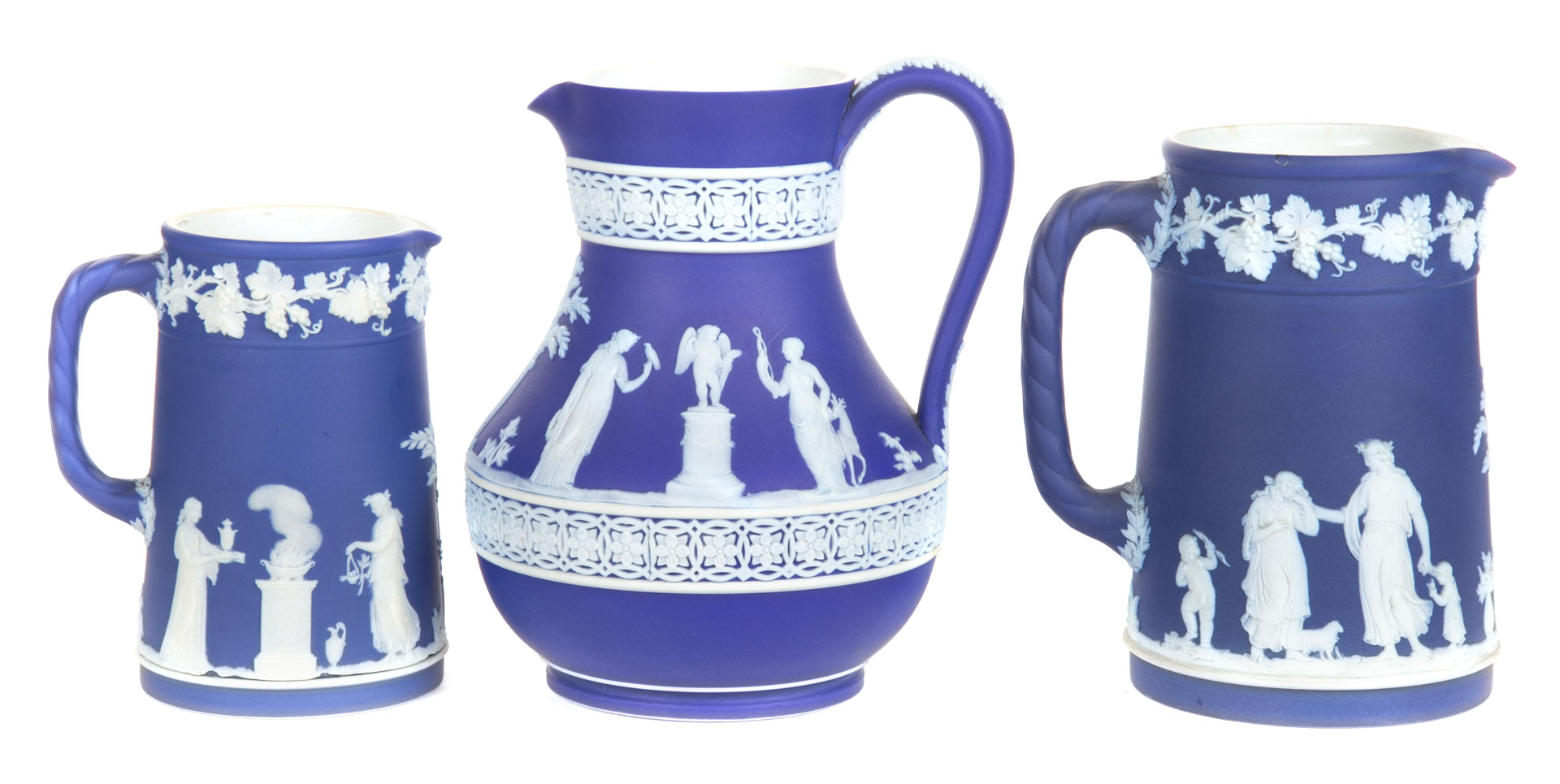 Appraisal: Three Wedgwood blue and white jasperware jugs th century to